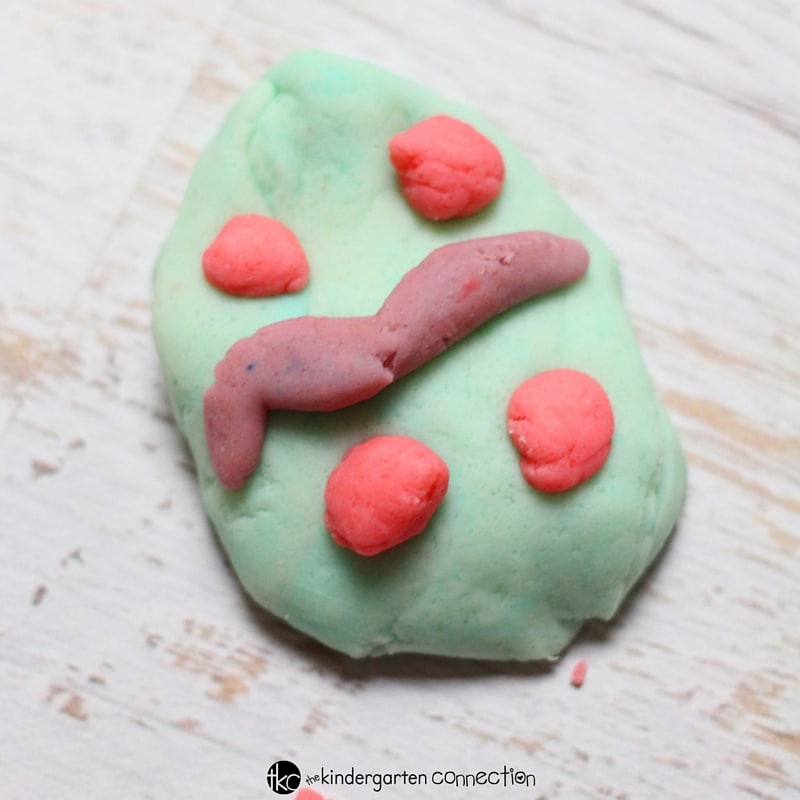 Decorate a play dough easter egg to explore patterns