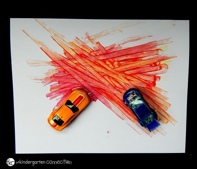 Learn about colors with this super fun color mixing activity! Grab some toy cars and paint for an engaging experiment your kids will love!