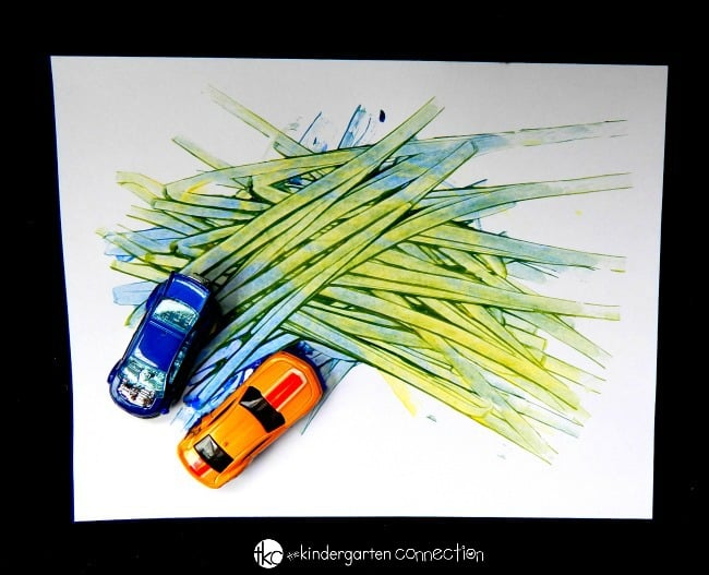 Learn about colors with this super fun color mixing activity! Grab some toy cars and paint for an engaging experiment your kids will love!