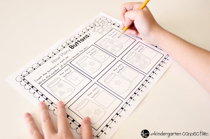 These Button Counting free printables are great for Pre-K & Kindergarten! Set includes a count and write practice sheet and a cut and paste practice sheet!