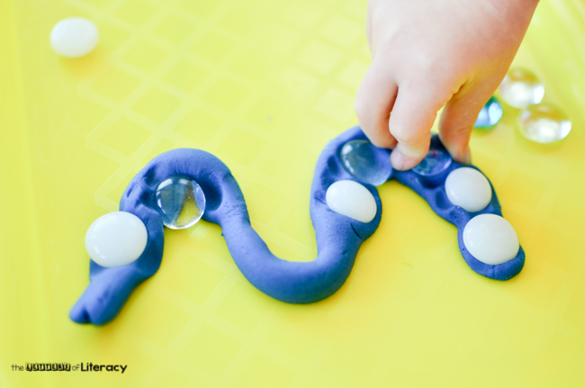 Try this play dough and glass bead pre-writing practice to help little hands develop the muscles and the skills needed for when they are ready to write.