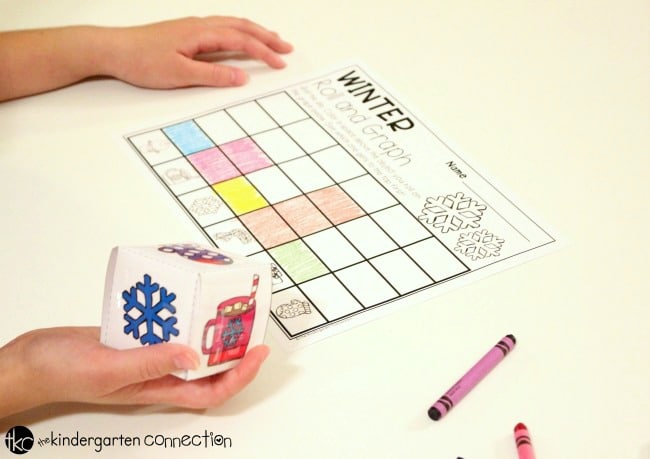 Have fun learning about graphing with this free printable winter roll and graph graphing activity! It's perfect for Pre-K and Kindergarten math centers.