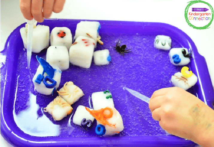 Pull out the ice cubes and spray them down with vinegar. We used pipettes!