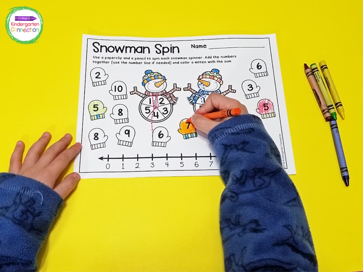 Just grab the snowman addition game printable, a pencil, crayons, and a paperclip and you have an easy-prep math center.