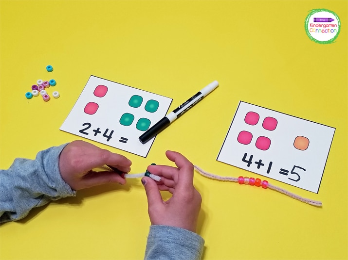 Use hands-on manipulatives like beads to model addition sentences with the addition cards.