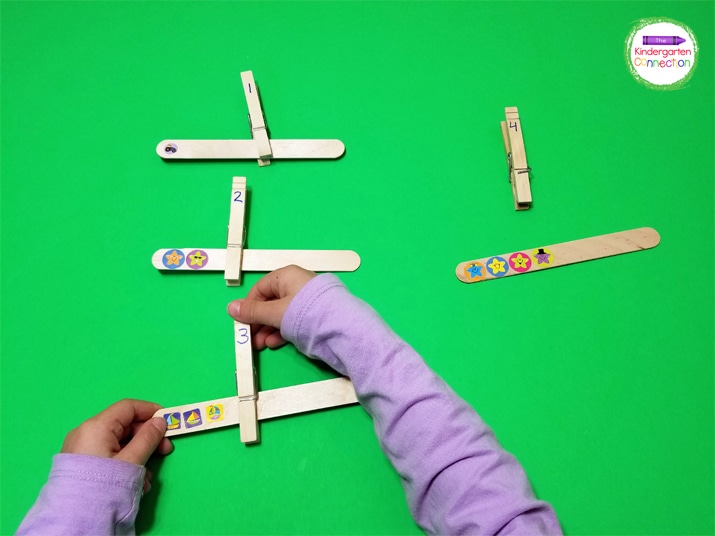 The clipping and unclipping of the clothespins is great fine motor practice.