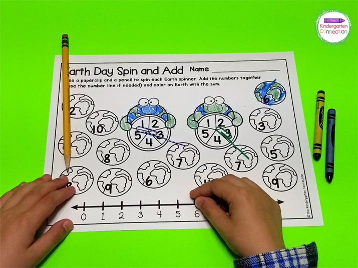 Students spin two numbers, add both of the numbers together, and color the earth with the sum in the Spin and Add version.
