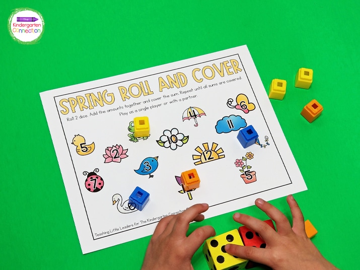 To play the addition version, students roll 2 dice, add the numbers together, and cover the sum with a counter on the roll and cover game board.