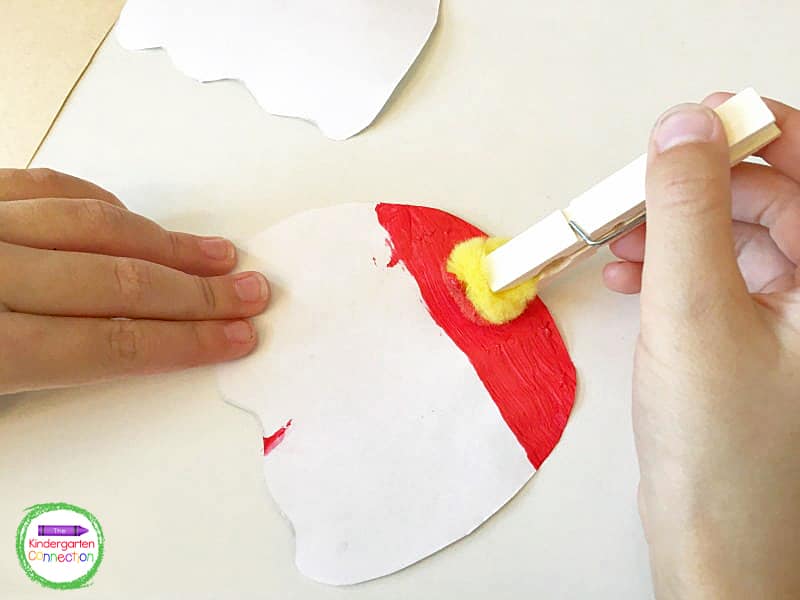 Clip the pom pom to the clothespin for a homemade painting tool.