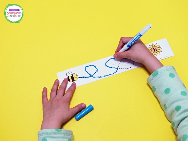 Tracing the lines from bees to flowers is a great way to help strengthen fine motor skills and this letter recognition activity is great practice.