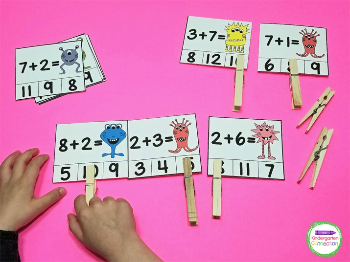To play, kids must solve the addition equation on the card, look at 3 choices of answers, and select the correct total.