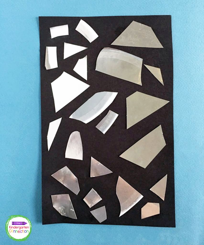 Kids can glue the silver pieces wherever they want on the black cardstock for a unique final product.