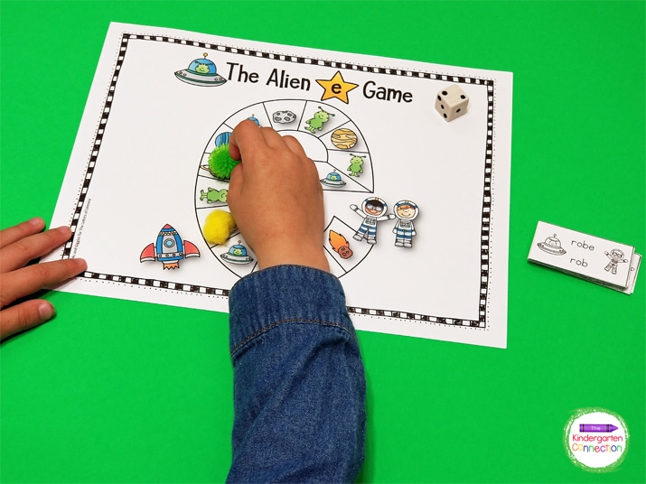 Students roll the dice and move that many spaces on the space themed game board.