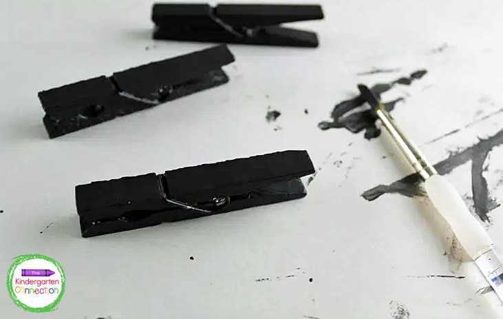 Paint the front and sides of the clothespins black.