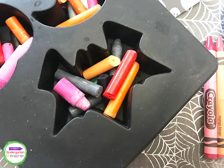After removing the wrappers, break the crayons into smaller pieces and place them in the silicone molds.