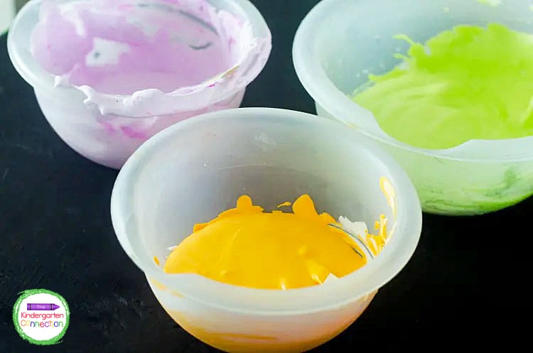 After all your supplies are ready, add 1/2 cup shaving cream and 1/2 cup of glue to  3 separate bowls.