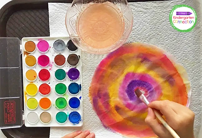 Encourage your students to cover the entire coffee filter with bright watercolor paint.
