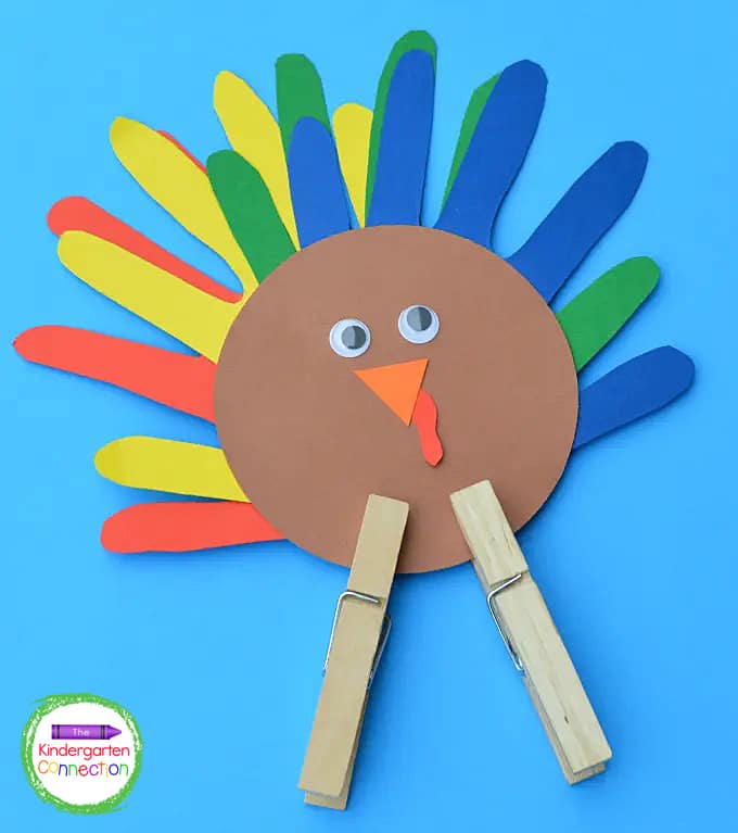 To finish it off, we attached two clothespins to the bottom of the brown circle for the turkey's legs.