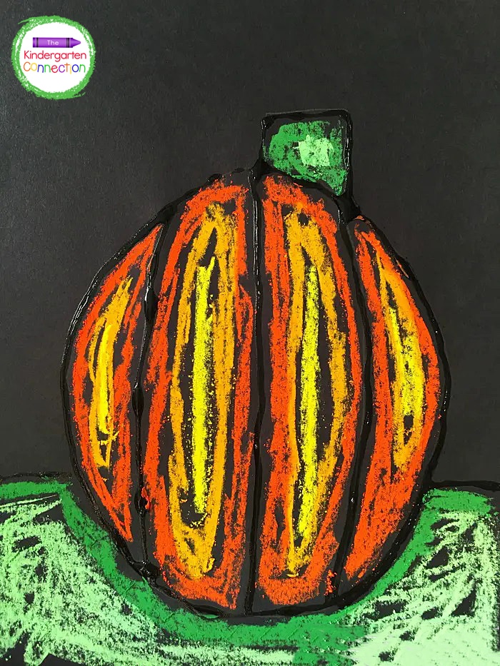 Once the glue has dried completely, invite students to use chalk pastels to add color to their pumpkin portraits.