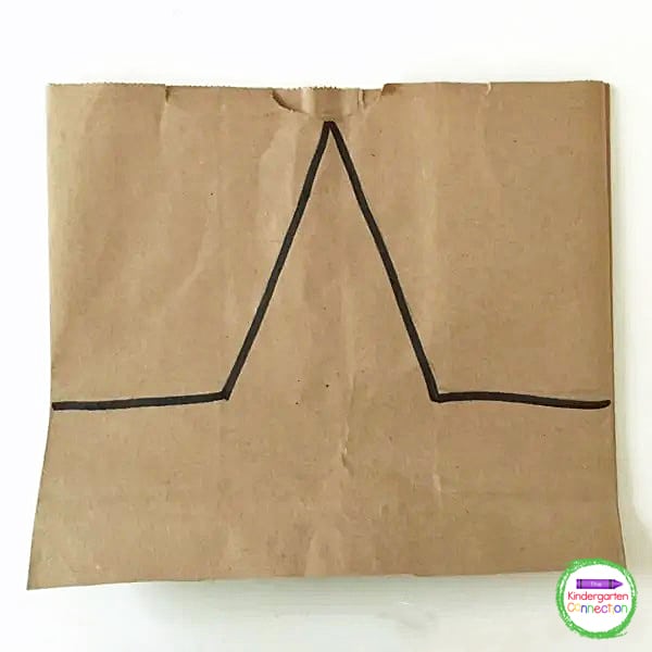 Next, use a pencil or maker to draw an outline similar to the the top of a star on the bag.