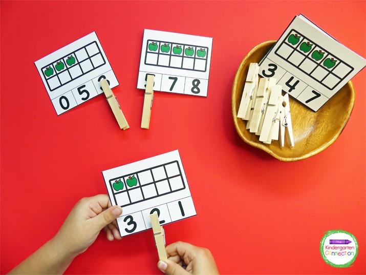 Students simply identify the number of apples in the ten frames and clip the corresponding number that shows the total.