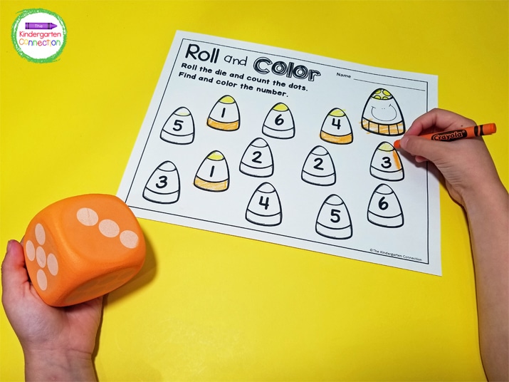 For the first roll and color game, we roll one die, find the numbered candy corn that matches, and color it in.