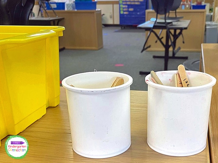 Write student names on popsicle sticks, add them to a cup, and pick a classroom helper from the cup every day.