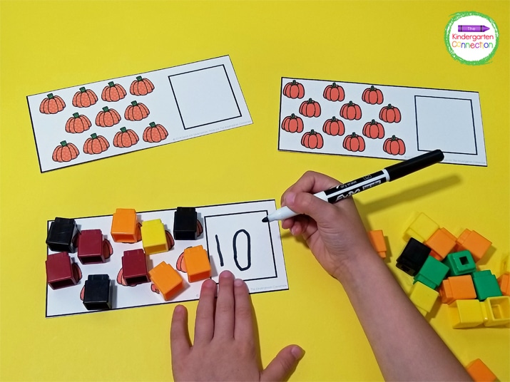 Students can use manipulatives like connecting cubes to help them count the pumpkins.