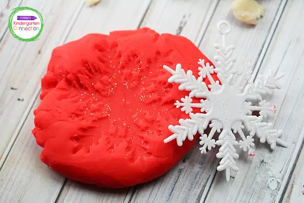 Use the snowflakes as stamps for the play dough.