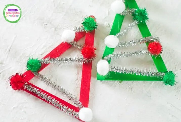 Now you get to glue pom poms on top of the silver pipe cleaners, decorating it like a tree.
