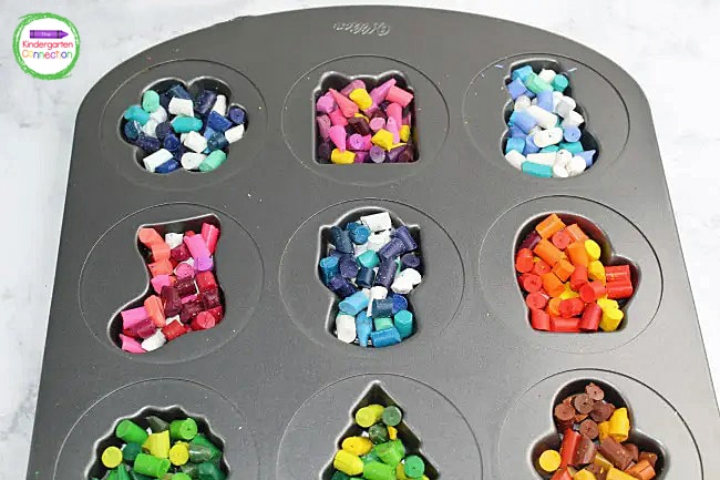 Fill the Christmas pan with broken crayon pieces. Make sure to fill each space to the top.