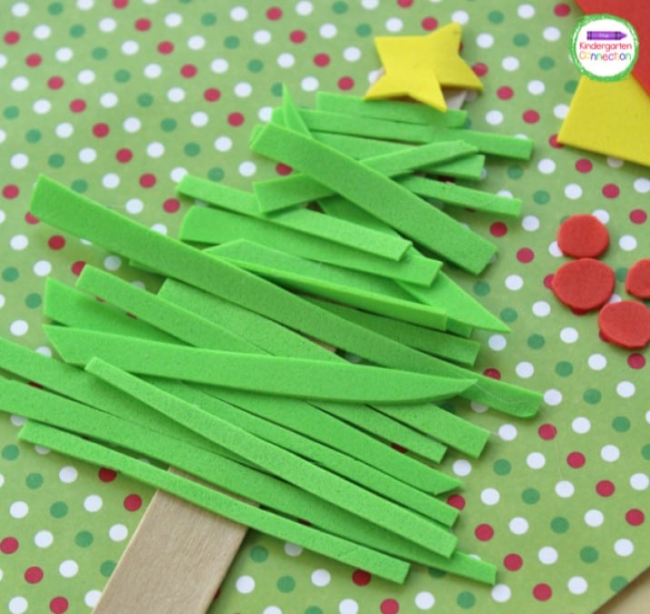 Start applying the green foam strips to the wooden stick as you work your way up to the top.