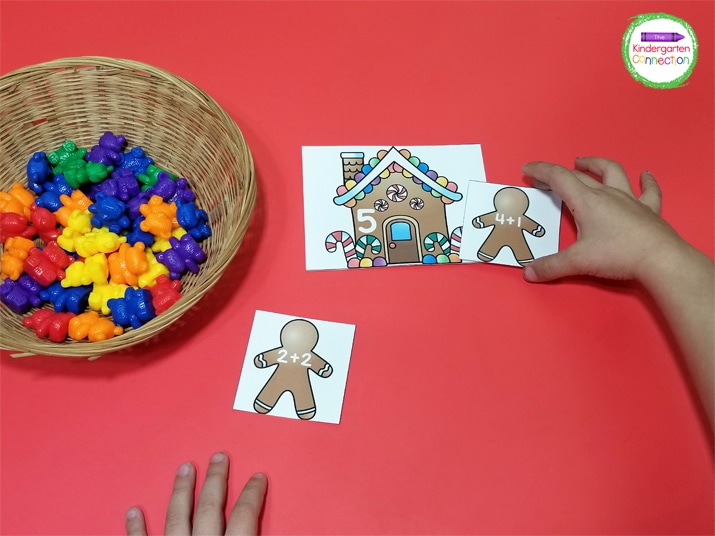 Continue picking up gingerbread men, adding, and finding their homes with the matching sum.
