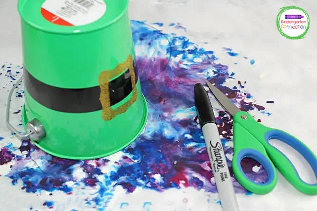 Allow the paper to cool and then trace a circle onto the paper with a cup or container.