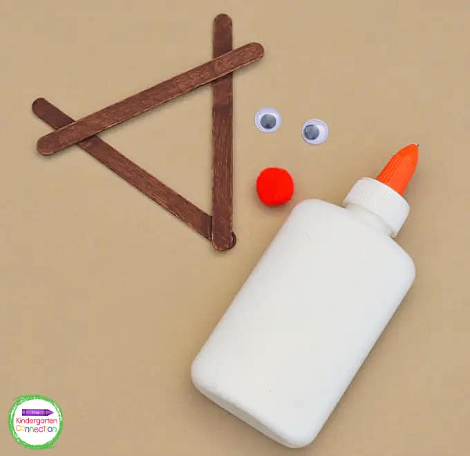 Paint the reindeer shaped craft sticks brown and allow them to dry.