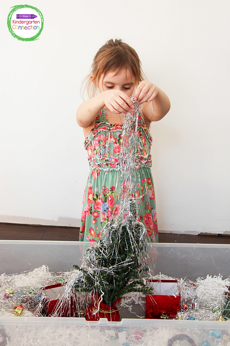 Kids love playing with the Christmas tinsel.