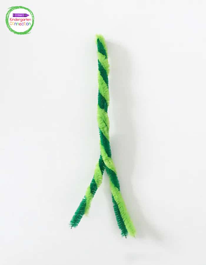 Once the 2 pipe cleaners are twisted together, fold them in half and twist again.