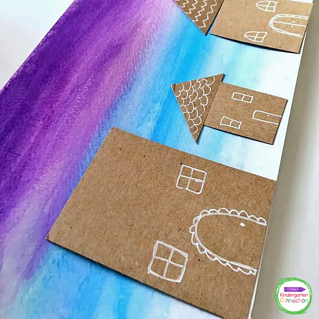You can encourage students to use a cool color palette of blues and purples to create this winter scene background.