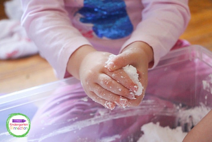 With some experimentation, kids learn that the fake snow can be formed into hard balls.