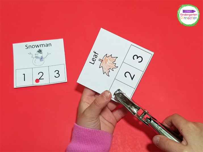 Cut each block out and hole punch the correct number of syllables.
