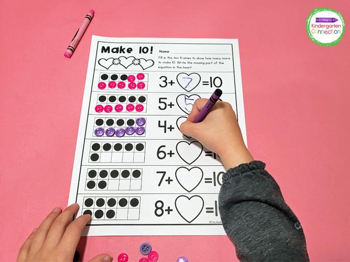 Grab some buttons or your favorite manipulative and start filling 10 frames! Write the number you need to make 10 in the heart.