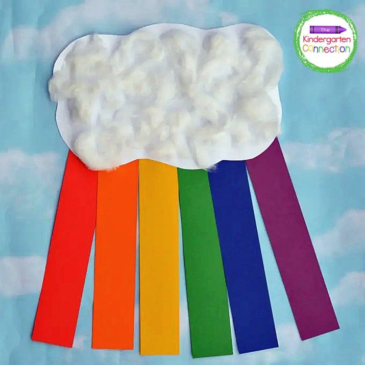 Finish this rainbow craft by slightly pulling cotton balls apart and gluing them onto the cloud to give it texture.