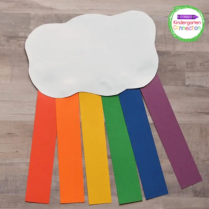 Glue the colored strips to the back of the cloud so they hang down.