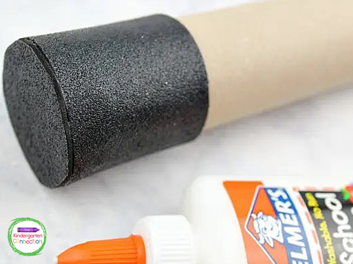 Cut a piece of black glitter foam long enough to wrap around the end of the tube. Glue the black glitter foam in place.