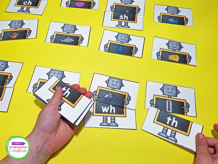 Students pick a robot picture card and find the corresponding robot digraph card to complete the match.