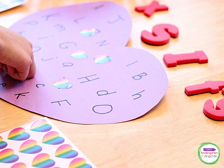 This Valentine alphabet activity continues until all letters have been covered up with a heart sticker.