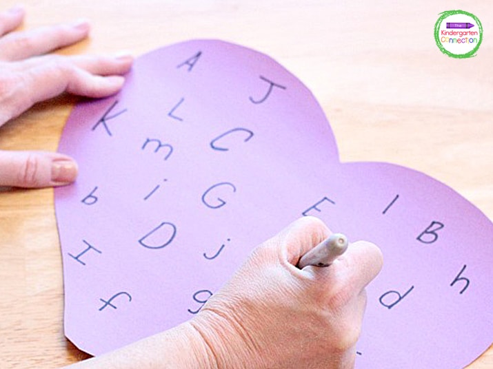 Use a marker or sharpie and write uppercase and lowercase letters scattered about the heart in no specific order.