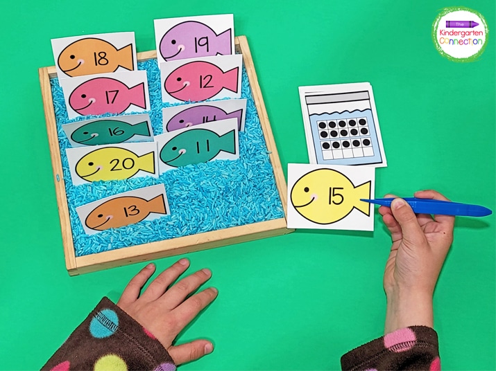 Add the fish number cards to a sensory bin for a hands-on way to play this counting game.