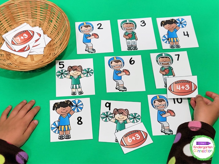 To play, students match the football equations with the player or cheerleader card with the correct sum.