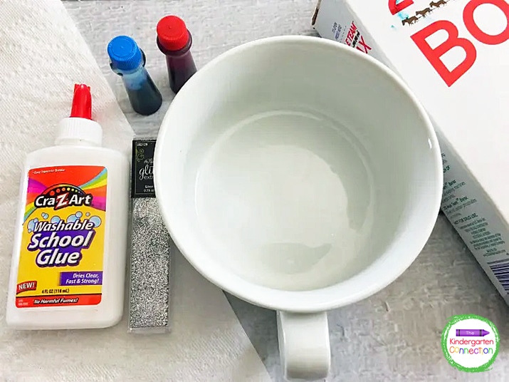 This patriotic slime recipe requires school glue, food coloring, borax, and silver glitter.
